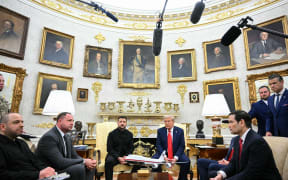 Ukrainian President Volodymyr Zelensky and US President Donald Trump participate in a meeting in the Oval Office of the White House in Washington, DC, on August 18, 2025. European leaders join Ukrainian President Volodymyr Zelensky in talks with US President Donald Trump on August 18, as they try to find a way to end Russia's offensive. The leaders heading to Washington on Monday to appear alongside Zelensky call themselves the "coalition of the willing." (Photo by Mandel NGAN / AFP)
