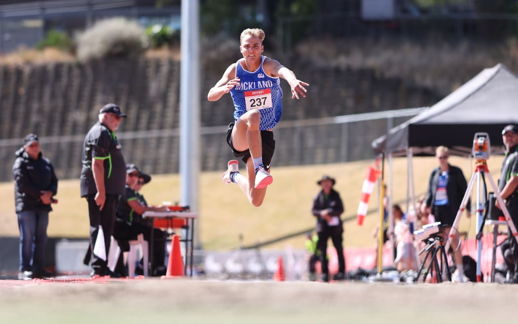 Ethan Olivier competes in the triple jump during the 2024 National Track & Field Championships in Wellington.