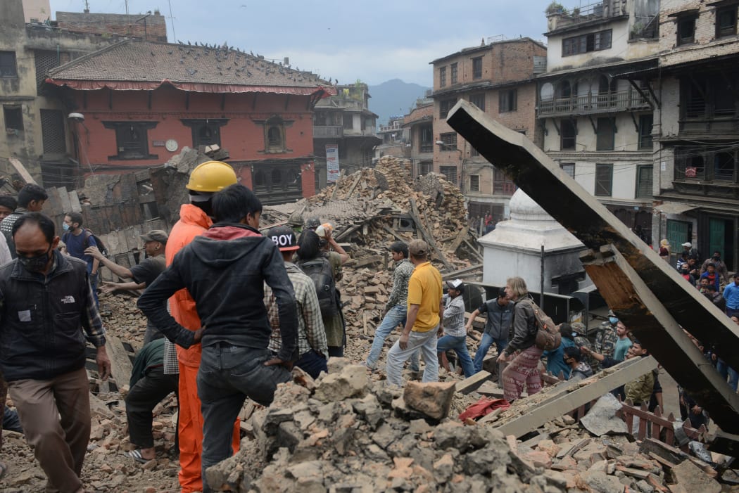 Rescue teams work to clear rubble in the capital's Durbar Square.