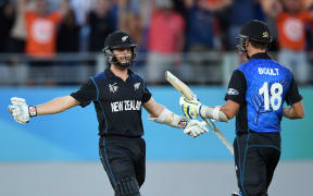Kane Williamson celebrates with Trent Boult.