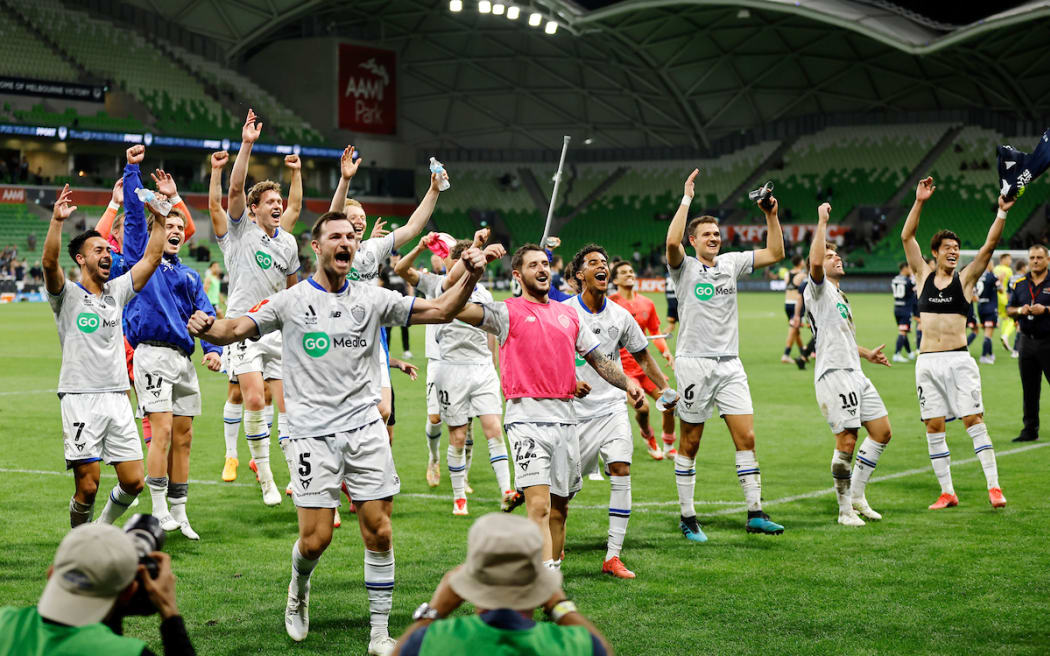 Auckland players celebrate their 2-0 win with their fans.