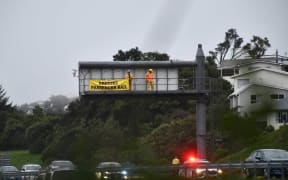 Restore Passenger Rail protesters occupying the gantry above State Highway 1 near Johnsonville on the morning of 5 May, 2023.