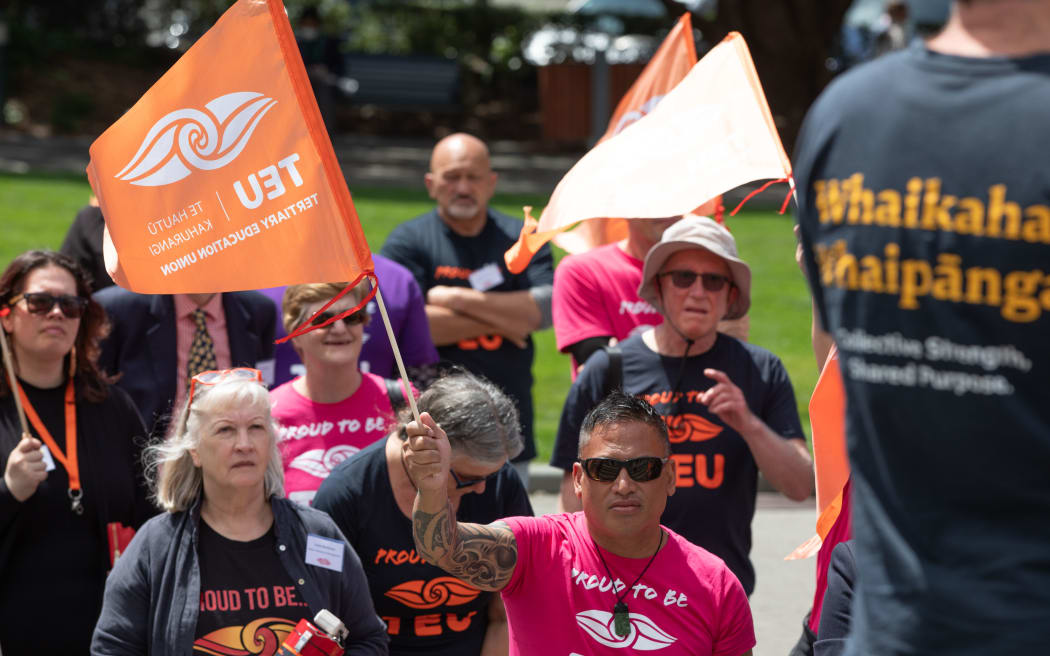Members of the Tertiary Education Union protest outside Parliament