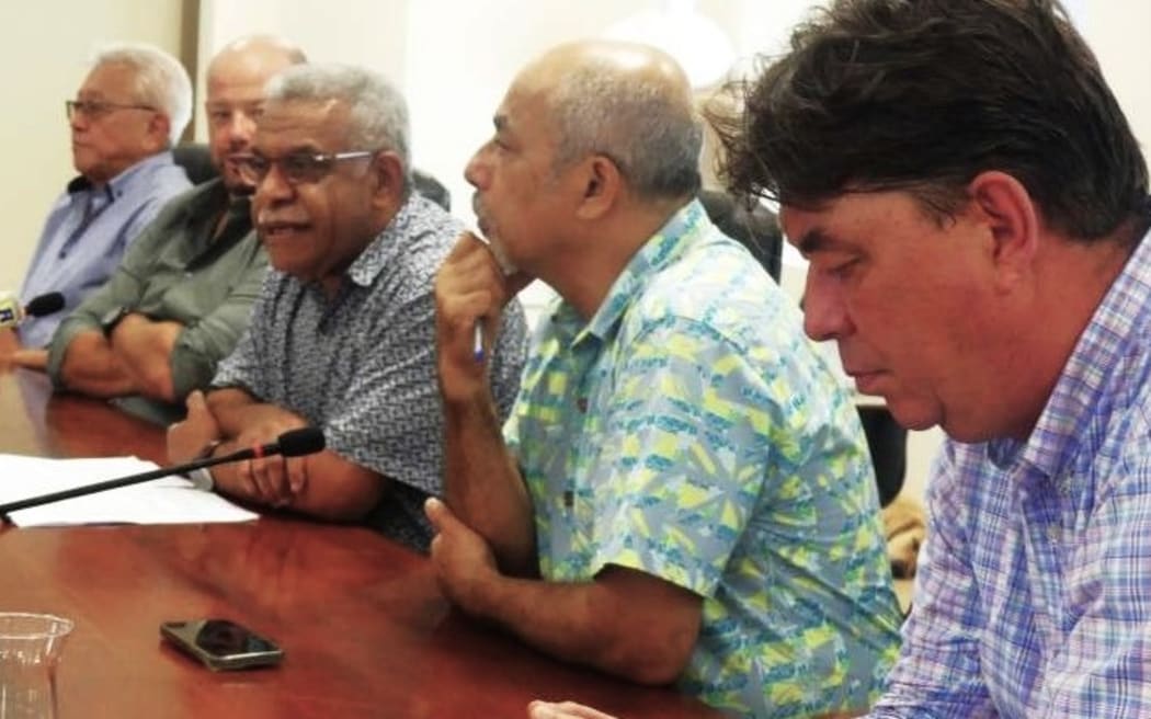 New Caledonia’s President Louis Mapou (centre) and his government hold a press conference on Wednesday 27 November 2024 after returning from Paris.
