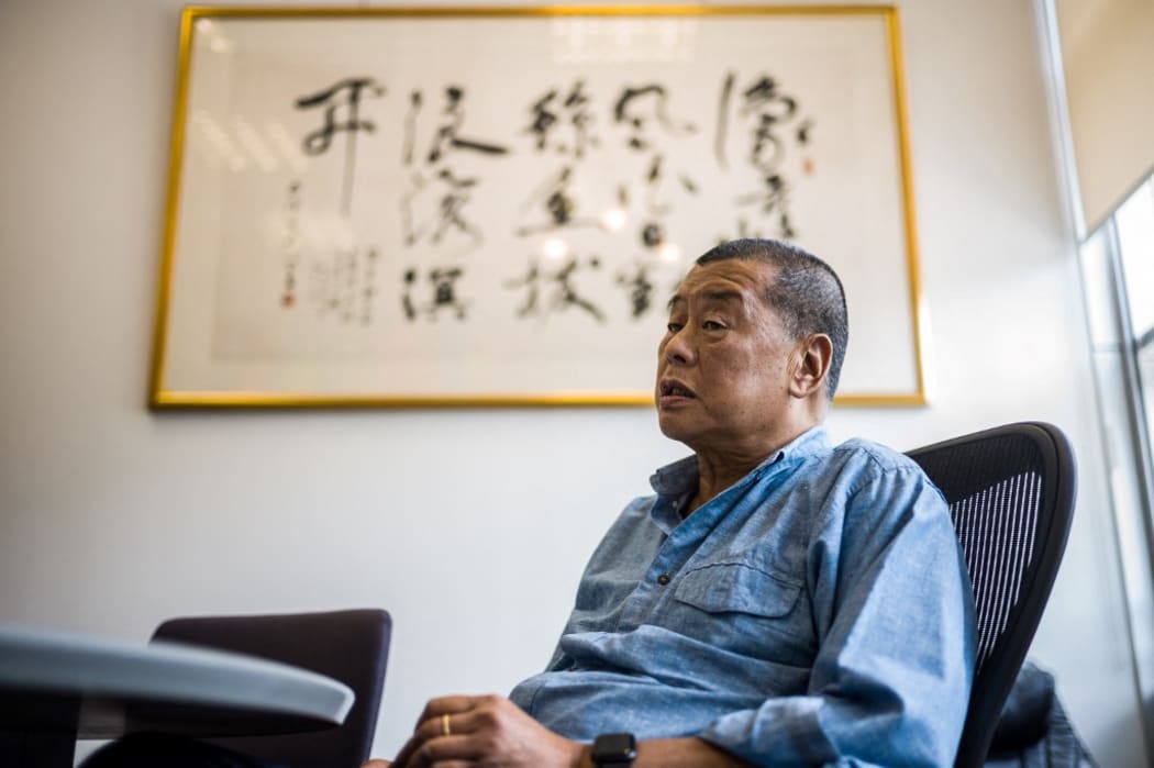 (FILES) In this file photo taken on June 16, 2020, millionaire media tycoon Jimmy Lai, 72, speaks during an interview with AFP at the Next Digital offices in Hong Kong.