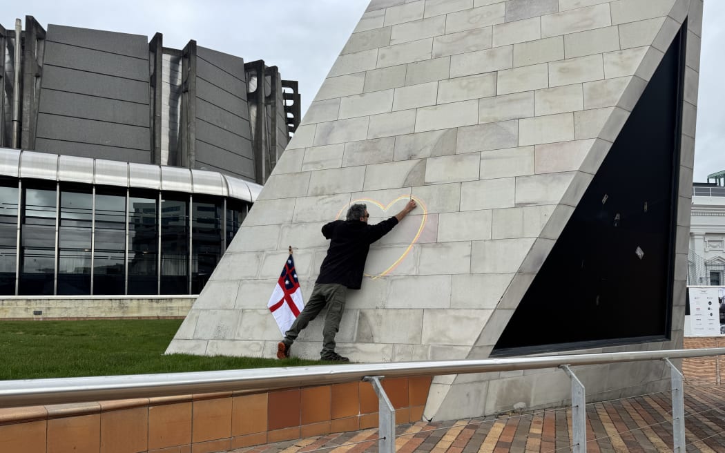 A man drawing near Wellington's City to Sea bridge.