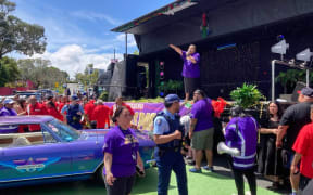 A Burger Fuel car collided with a brass band at the Avondale Santa parade.