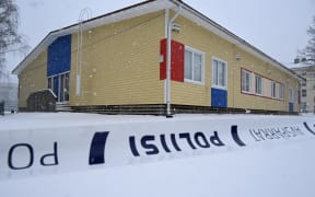 Police tape cordons off the Viertola School in Vantaa, in the north of  the Finnish capital Helsinki, on April 3, 2024, one day after a 12-year-old opened fire inside the school, killing a classmate and seriously injuring two other children. Finland will fly its flags at half-mast on April 3, 2024, to mark the country's mourning after a 12-year-old opened fire at a school, killing one classmate and seriously injuring two others in the city of Vantaa. (Photo by Jussi Nukari / Lehtikuva / AFP) / Finland OUT