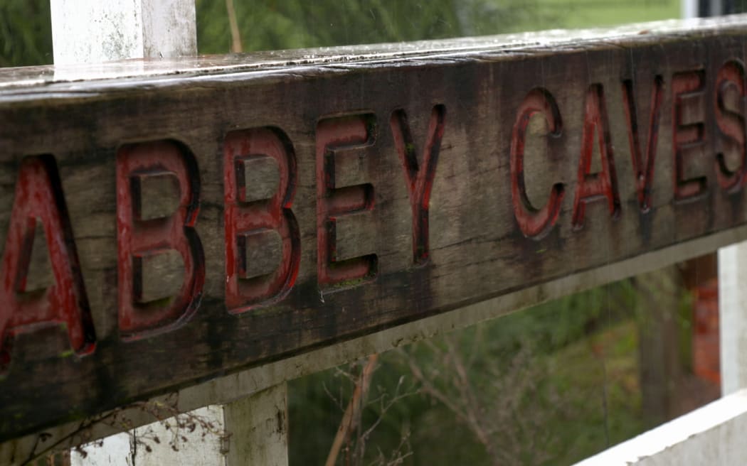 The rain soaked sign outside Abbey Caves