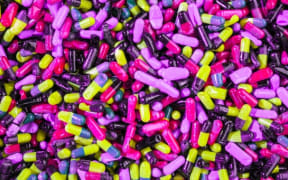 Purple pills (Photo by JOSHUA COLEMAN on Unsplash)