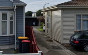 A long driveway with a number of units down it.