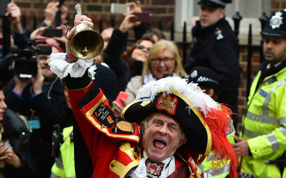 Town crier Tony Appleton makes the announment of the birth.