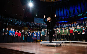 Sue Densem conducting The Big Sing 2022 massed choir at the Christchurch Town Hall