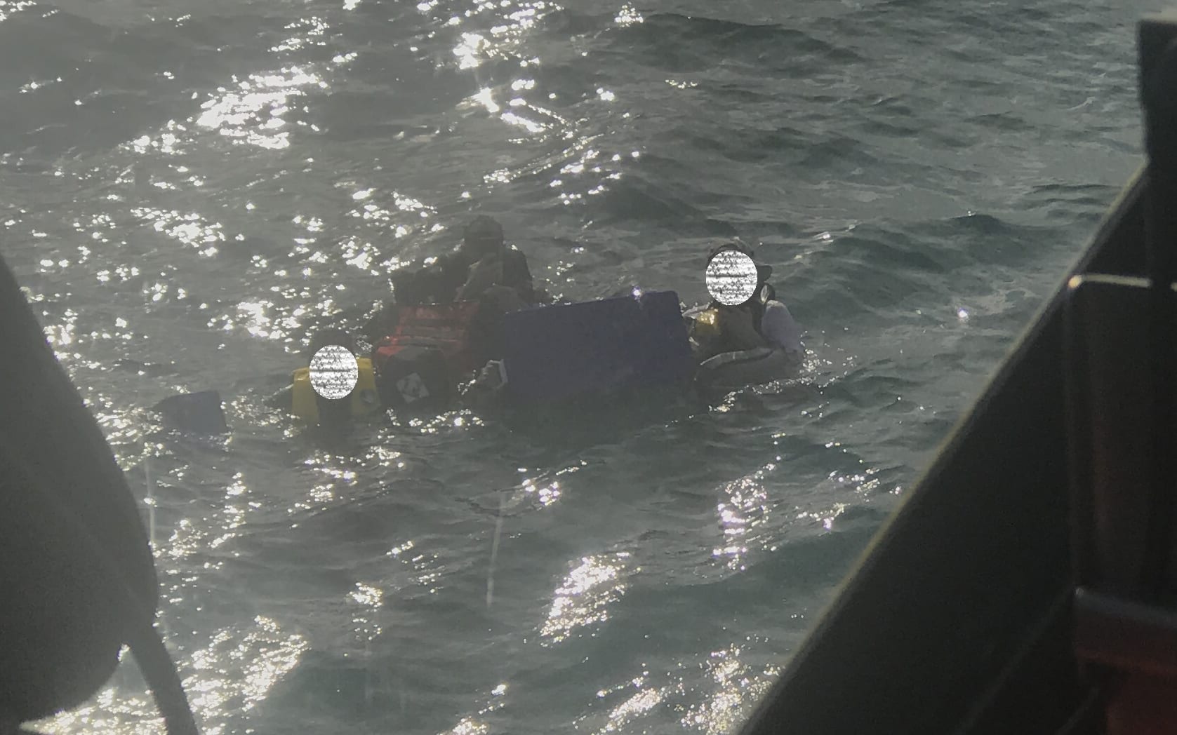 Three men were in the water and using a chilly bin for a float when they were rescued.