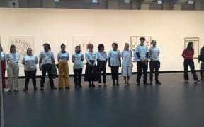 Students protest a Theo Schoon exhibition at Wellington City Council.