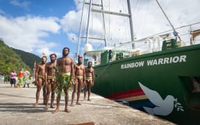 Traditional dancers welcome Rainbow Warrior to Port Vila Vanuatu.