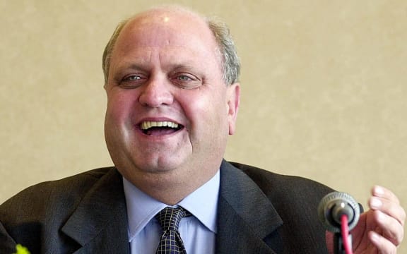 Former World Trade Organisation chief Mike Moore speaks at a press conference 14 February 2000 in Singapore.