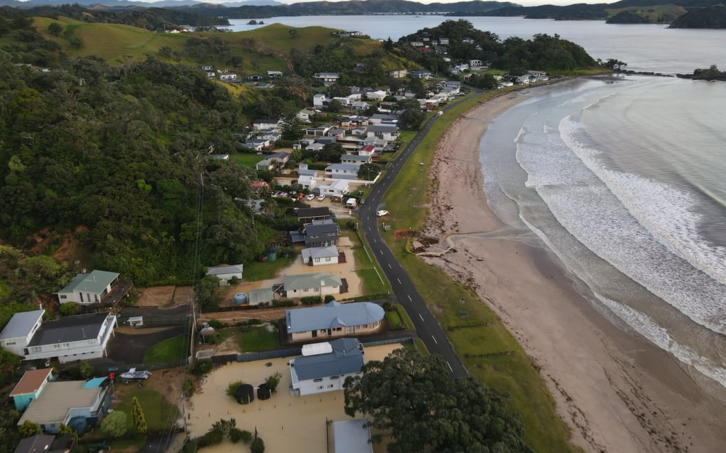 Floodwaters at Ōakura Bay as seen from the air.