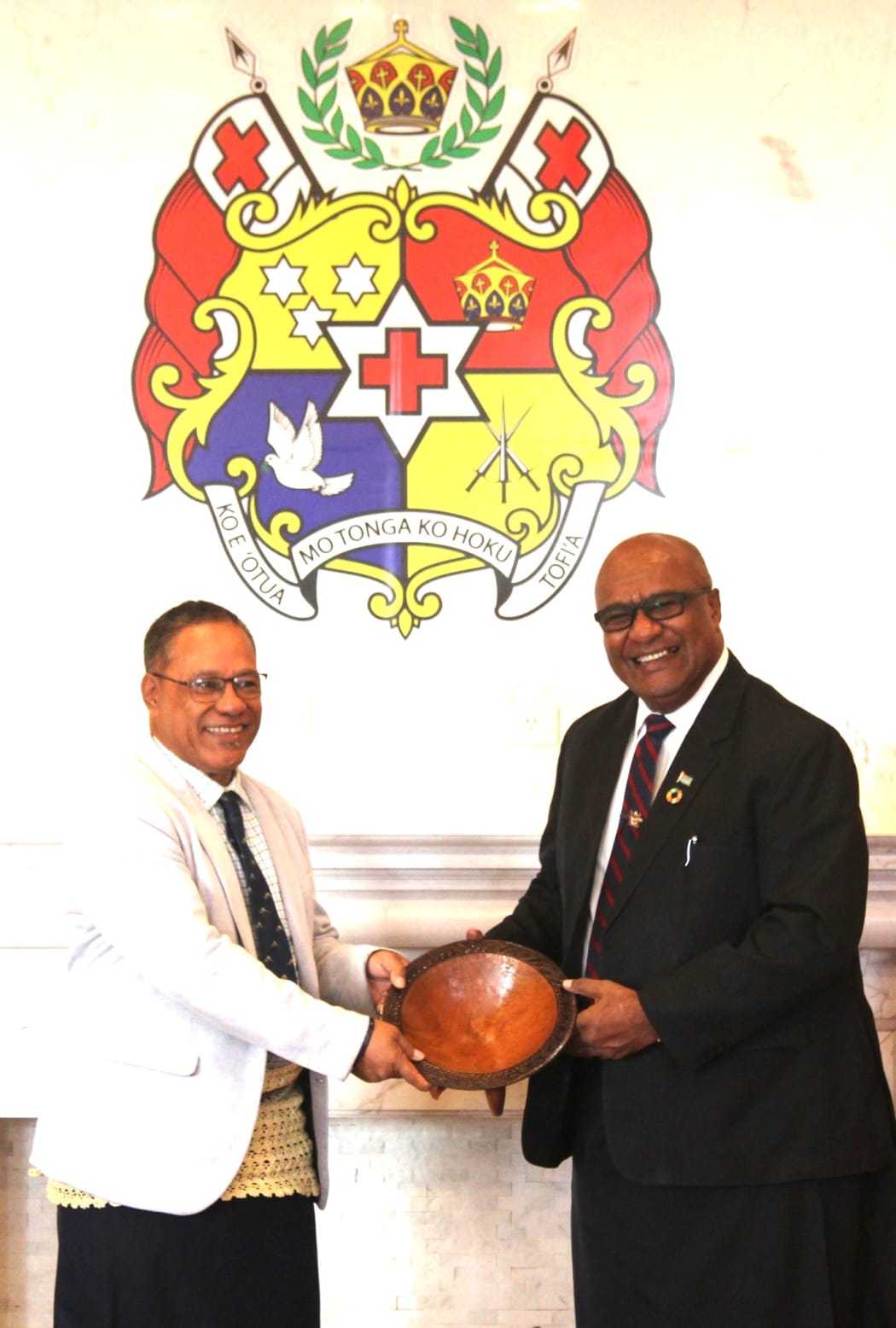 Tonga's Acting Prime Minister Dr Taniela Fusimalohi, left, receives a tanoa gift from Fiji's Deputy Prime Minister and Minister for Trade Manoa Kamikamica in Nuku'alofa on Tuesday.