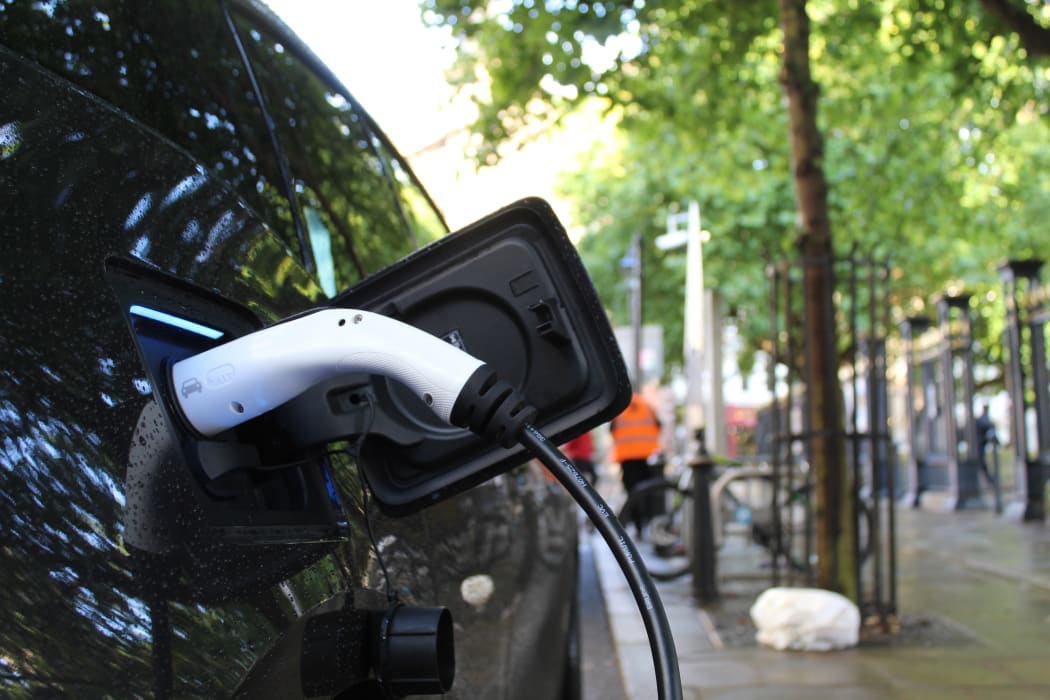 Charging an electric vehicle. EV. Electric car.