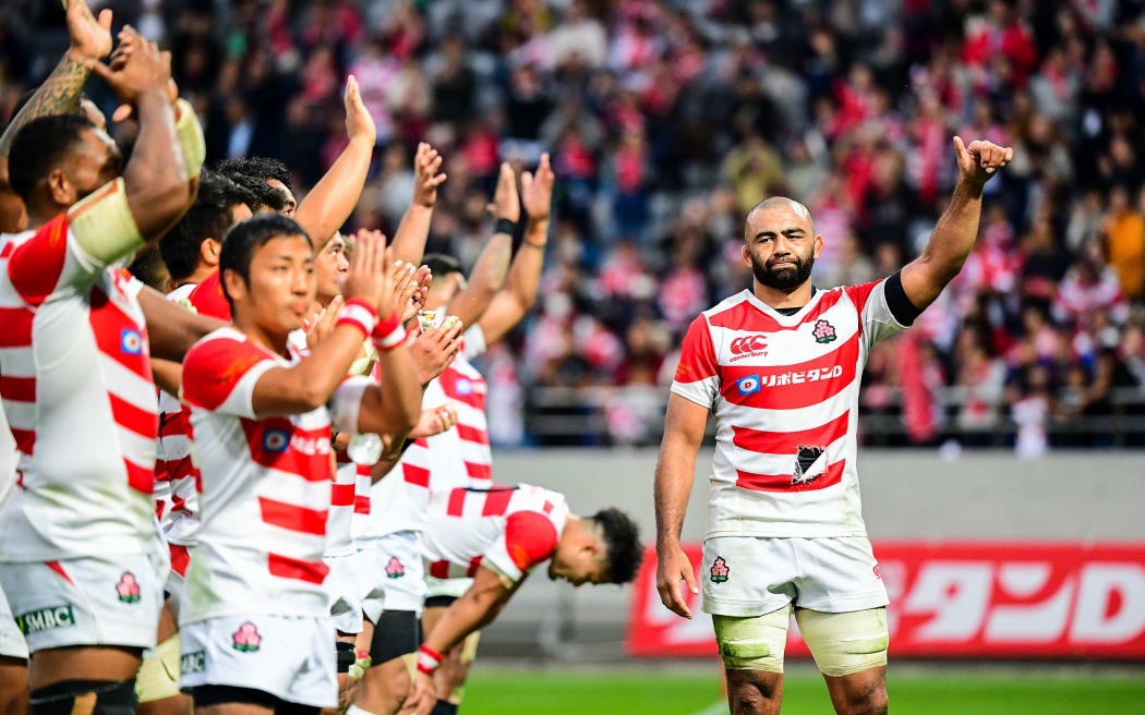 Japan, led by captain Michael Leitch, thank the crowd after the match against All Blacks.