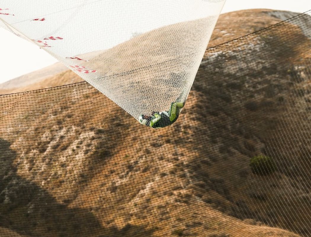 Skydiver Luke Aikins lands safely after jumping 25,000 feet from an airplane without a parachute or wing suit.