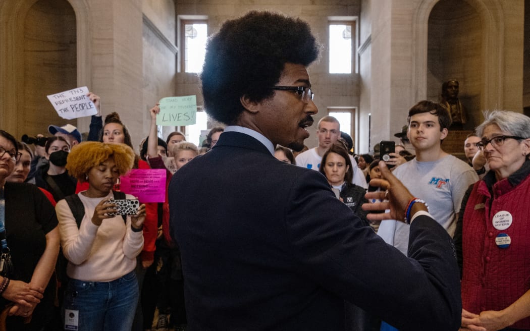NASHVILLE, TN - APRIL 06: Democratic state Rep. Justin Pearson (R) of Memphis speaks with supporters after being expelled from the state Legislature on April 6, 2023 in Nashville, Tennessee. Pearson and fellow Democratic Reps. Gloria Johnson of Knoxville and Justin Jones of Nashville were brought up for expulsion for leading chants of protesters from the floor in the wake of a mass shooting at a Christian school in which three 9-year-old students and three adults were killed by a 28-year-old former student of the school on March 27. Pearson and Jones, who is also Black, were expelled while the vote against Johnson, who is white, fell one vote short.   Seth Herald/Getty Images/AFP (Photo by Seth Herald / GETTY IMAGES NORTH AMERICA / Getty Images via AFP)