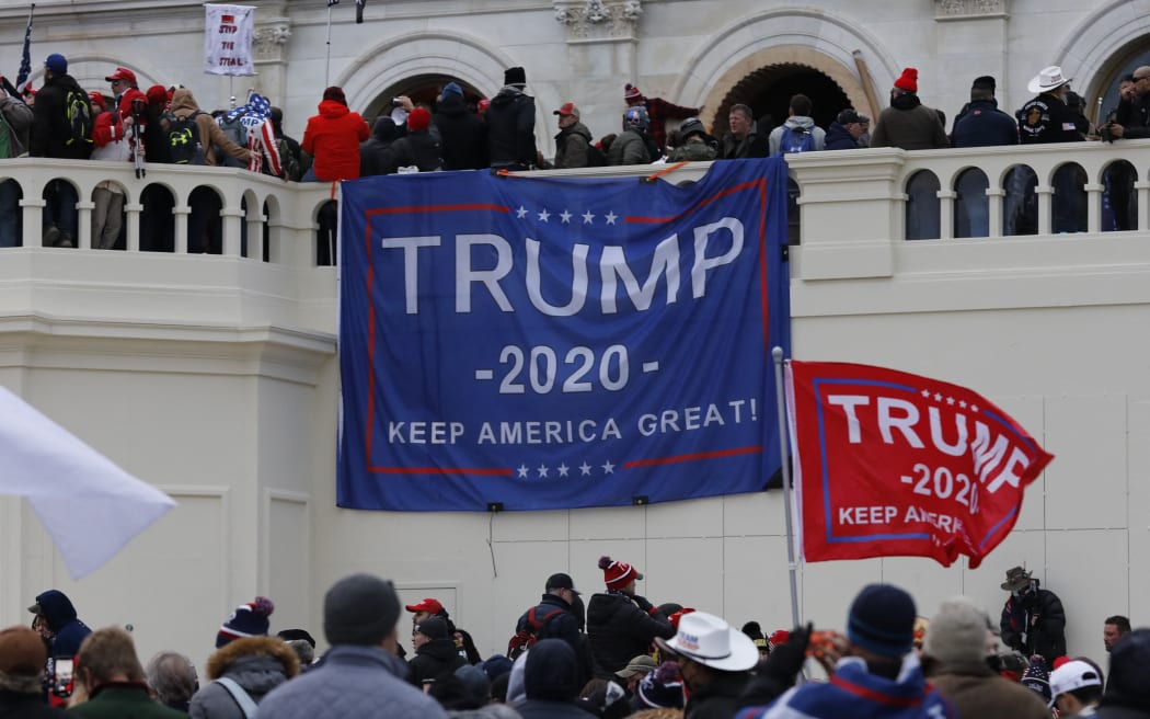 Supporters of US President Donald Trump storm the US Capitol during a rally to contest the certification of the 2020 US presidential election results by Congress at the Capitol Building in Washington.