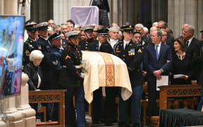 A US armed forces body bearers arrive with the casket of the former US Vice President Dick Cheney at the Washington National Cathedral for his funeral service in Washington, DC on November 20, 2025. Dick Cheney, celebrated as a master Republican strategist but defined by the darkest chapters of America's "War on Terror," was honored Thursday in a funeral attended by Washington's elite that pointedly left out President Donald Trump. (Photo by SAUL LOEB / AFP)