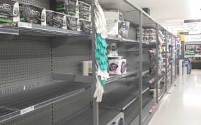 Shelves at Countdown, St Lukes, Auckland, were stripped of toilet paper following the announcement the country will move to red.