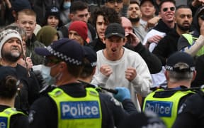 Protesters march through the streets during an anti-lockdown rally in Melbourne on 18 September.