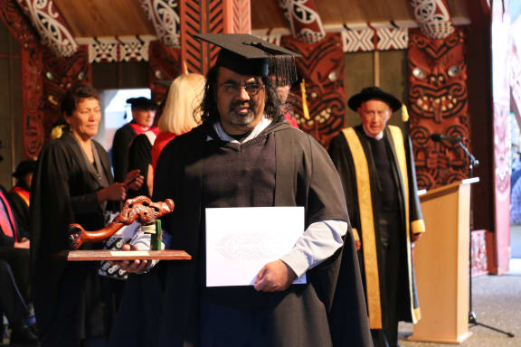 Te Moanaroa receiving his Masters Degree and award for Top Scholar, 2017.