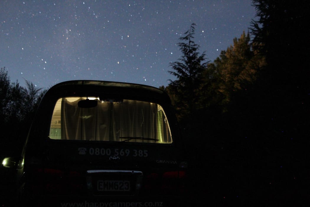 freedom camping. van. night time.