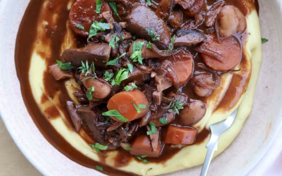 A dish of Vegetarian Bourgignon with garlic mash