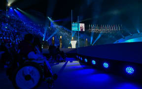 International Paralympic Committee President Andrew Parsons (C) delivers a speech during the Milano Cortina 2026 Winter Paralympic Games opening ceremony at Arena di Verona in Verona on 6 March, 2026. (Photo by Stefano RELLANDINI / AFP)