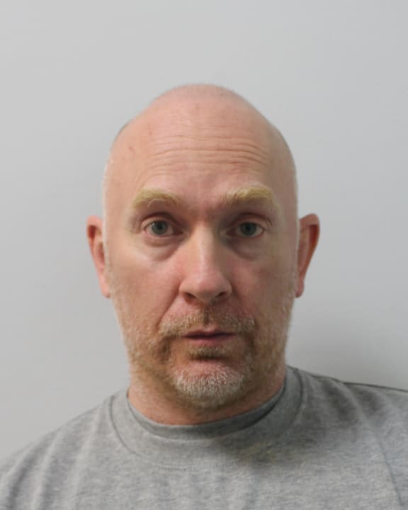 An undated handout picture released by the Metropolitan Police on July 9, 2021, shows British police officer Wayne Couzens, 48, who pleaded guilty to the murder of Sarah Everard, via video link at London's Old Bailey court. Wayne Couzens, who served in the Metropolitan Police's elite diplomatic protection unit, on Friday pleaded guilty to the murder of a woman whose disappearance sparked outrage and a national debate about women's safety. (Photo by METROPOLITAN POLICE / AFP) / RESTRICTED TO EDITORIAL USE - MANDATORY CREDIT "AFP PHOTO / METROPOLITAN POLICE " - NO MARKETING - NO ADVERTISING CAMPAIGNS - DISTRIBUTED AS A SERVICE TO CLIENTS