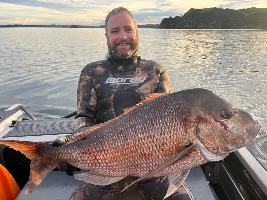 Musician and fisherman Gerry Paul fishing in Northland