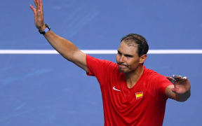 Spain's Rafael Nadal waves to spectators after losing his singles match to the Netherlands in Davis Cup finals in 2024.