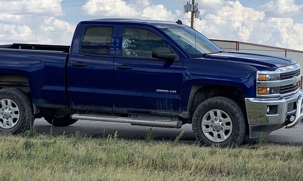 This handout images obtained courtesy of Ernst Villanueva taken on August 31, 2019 show a car with multiple bullet holes on the windows after a gunman open fire in the I-20 highway in between Odessa and Midland, Texas.