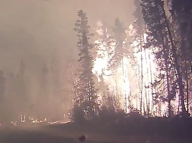 A dashcam video of residents evacuating the Canadian city of Fort McMurray Fire  during a massive forest fire.
