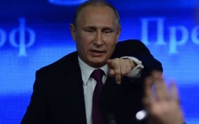 President Putin answers questions at a three-hour media conference.