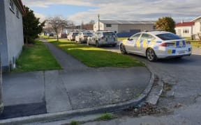 Gore house surrounded by armed police.