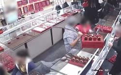 A screenshot from CCTV showing Gurdeep’s son, Sunny Singh, grabbing a ceremonial sword to face burglars.