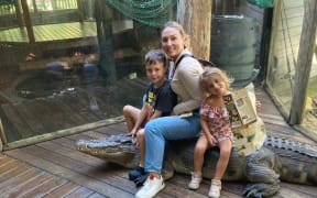 New Zealander Erica Dill-Russell with her children at a zoo in Florida.