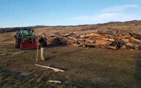 Ken Gillespie prepares the bonfire for the Brass Monkey Rally in Central Otago