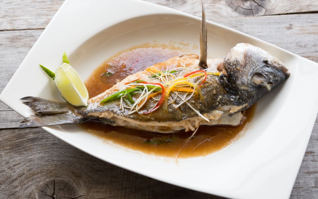 Grilled dorado fish with soy sauce and lime