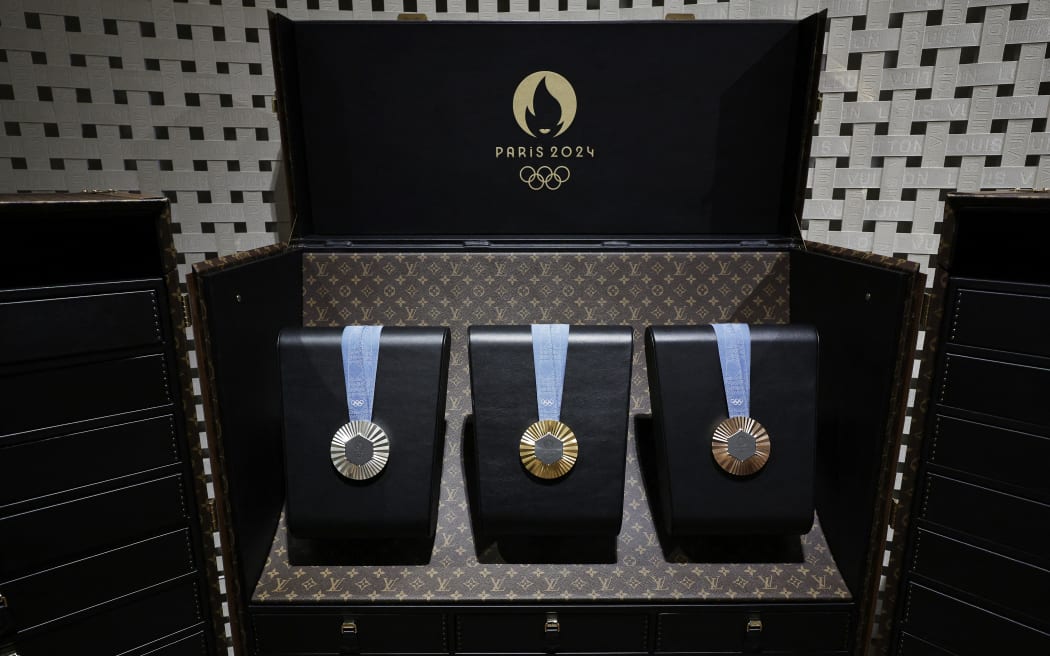 The 2024 Paris Olympic Games medals are displayed inside a custom-designed trunk manufactured by Louis Vuitton, an LVMH brand partner of the Paris Olympic and Paralympic Games, during a gathering at LMVH in Paris on July 22, 2024, ahead of the start of the 2024 Paris Olympic Games. (Photo by STEPHANE DE SAKUTIN / AFP)
