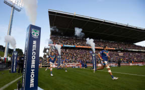 Warriors captain Tohu Harris leads the team out in their first home game at Mt Smart in more than 100 days.