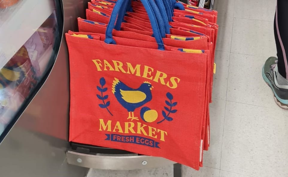 In some stores, Countdown is selling re-usable jute shopping bags that have the words "FARMERS MARKET" printed on them as part of the design.