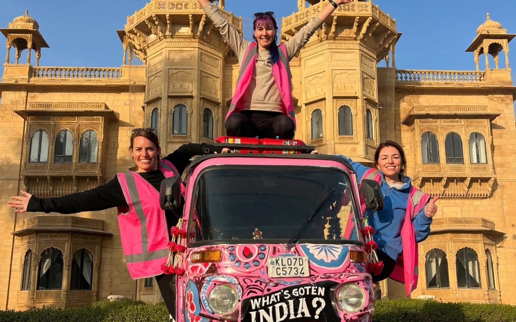 Kiwi adventurers, Ellen Richardson, Fiona Sandford and Clair Scott with their rickshaw in front of the Jaisalmer Fort in India.
